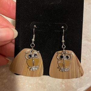 Owl earrings.with faux wood grain background.